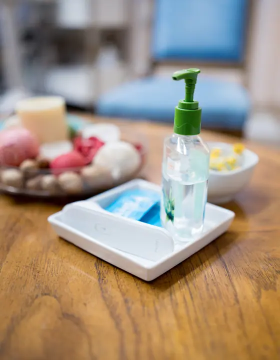 Sanitizer and client tray in the consultation area